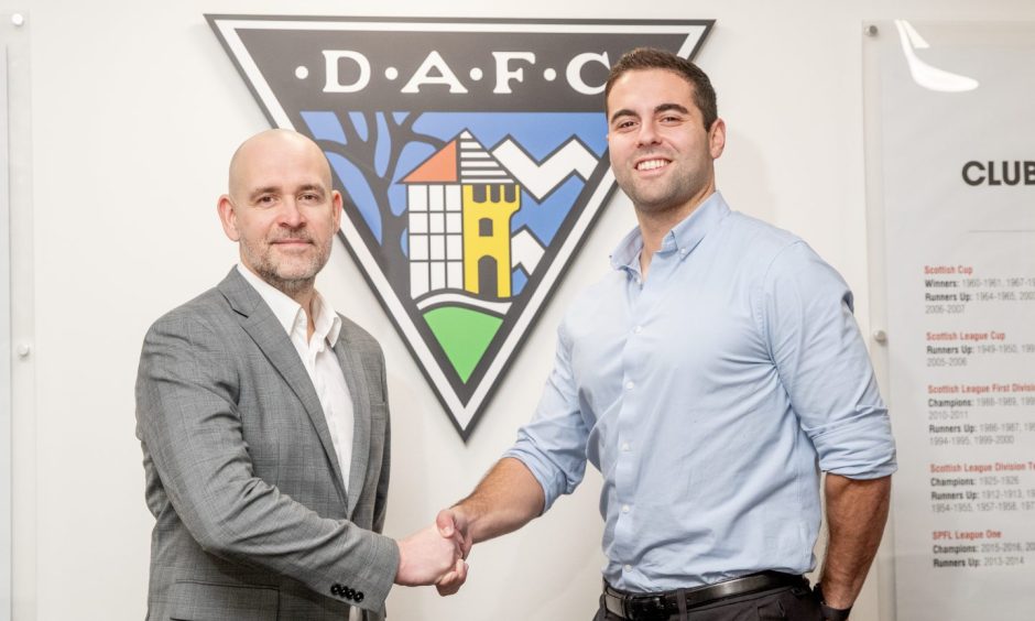 Dunfermline chairman and CEO David Cook and Park Bench UK representative Kobi Waterman shake hands on the takeover deal.