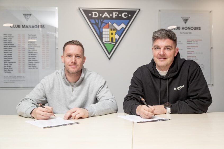 Michael Tidser and assistant Kevin McDonald put pen to paper on their contracts with Dunfermline.