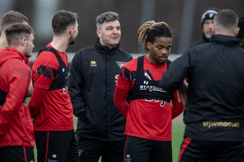 Assistant Kevin McDonald on the training pitch with the Pars players.