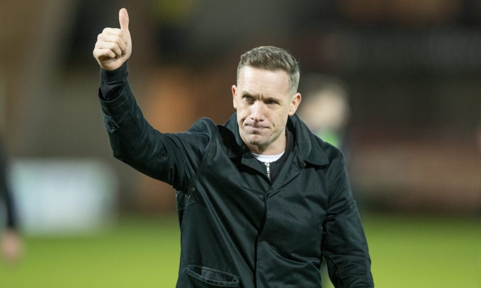 New Dunfermline Athletic head coach Michael Tidser gives the thumbs up to fans.