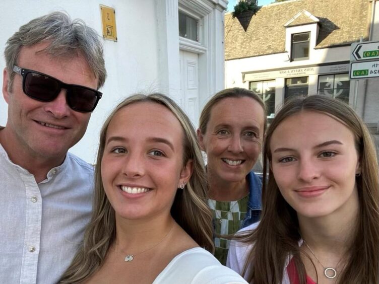 Carol with her family - husband Nick, daughters Emma (left) and Lucy.