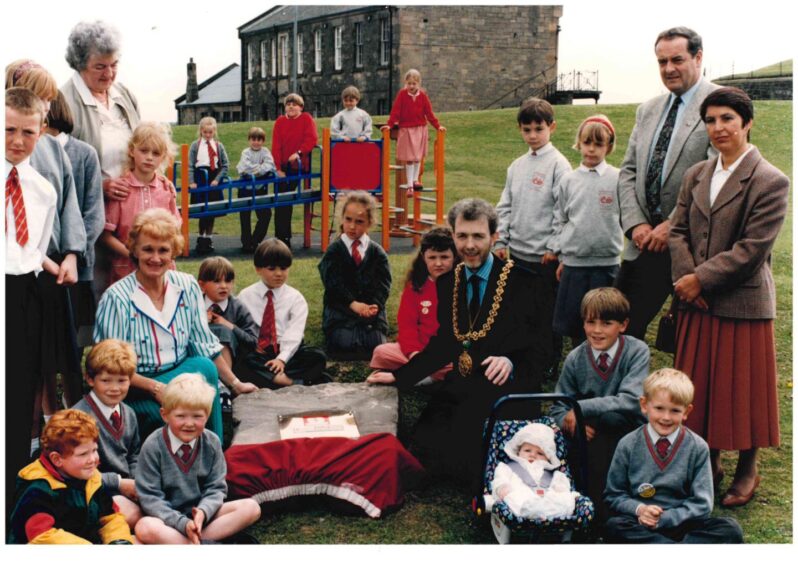 members of the Gillies family at the local play park