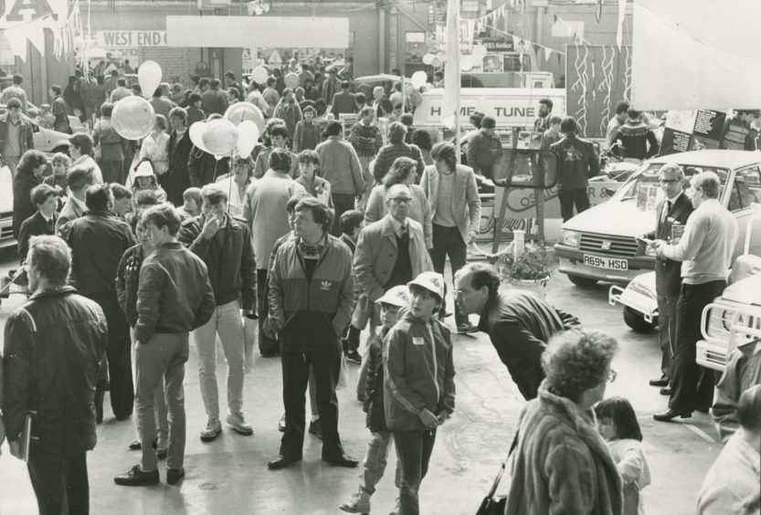 Visitors inspect vehicles at the Dundee Motor Show in May 1985.