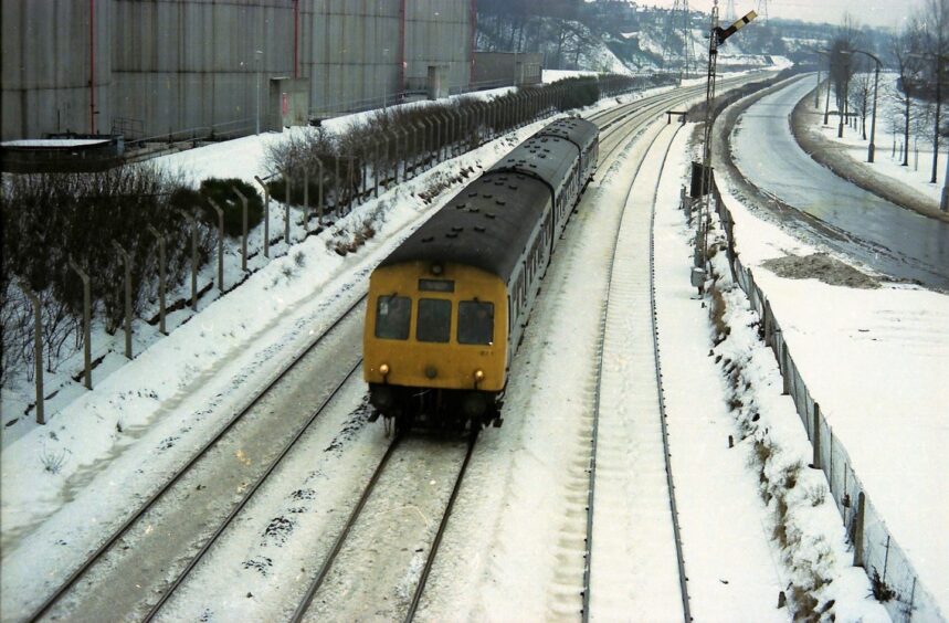 an elevated shot of class 101 unit heading towards Dundee