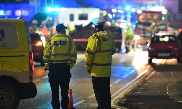 Police have closed the road. Image: Stuart Cowper