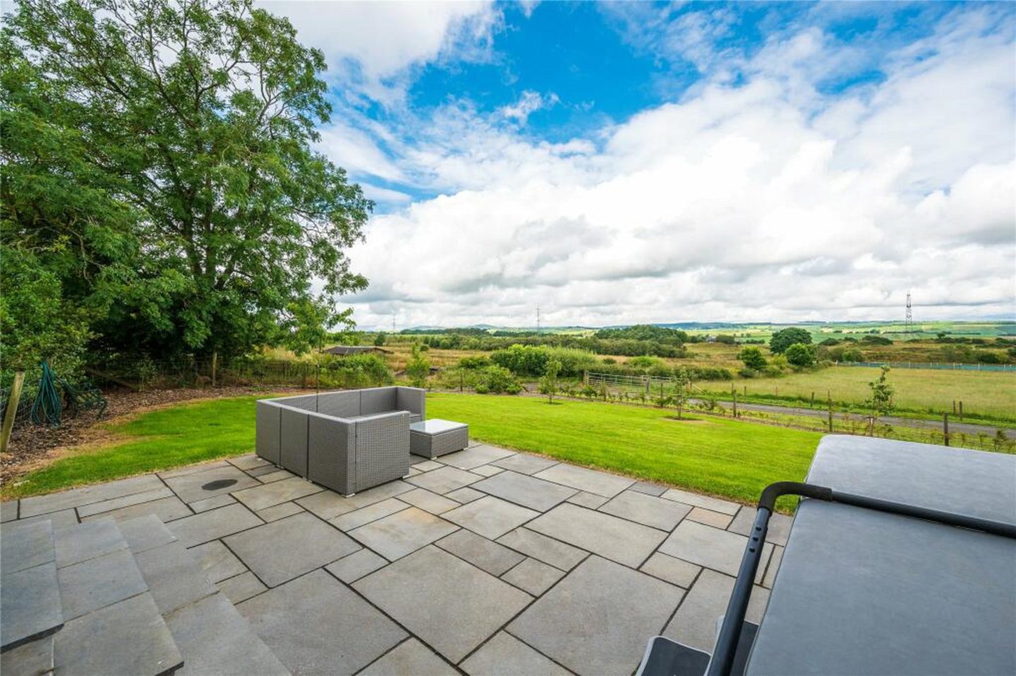 Large patio with panoramic views across Fife. 