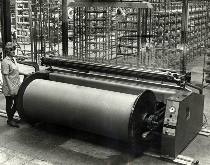 A worker is pictured with new “beaming” machinery at the Boase Spinning Company