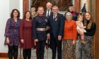 George Lawrie, standing next to the uniformed Stephen Leckie, and family at the British Empire Medal presentation in Perth.