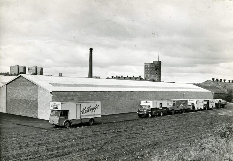 vans parked outside the new warehouse in May 1965. 