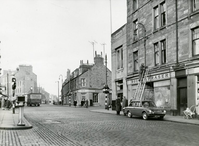 a Dundee street with the Bowbridge Bar and Rough and Fraser store.