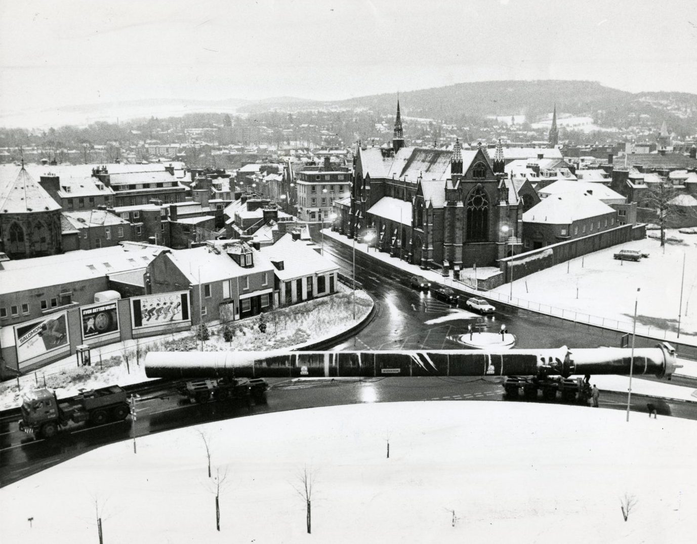 an elevated view showing a snowy scene as a 140ft section of pipeline passes through Perth 