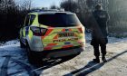 Police with dogs search Townhill Country Park in Dunfermline.