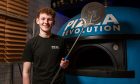 Calum Wardlaw at the pizza oven in Pizza Revolution, Broughty Ferry. Image: Kim Cessford / DC Thomson