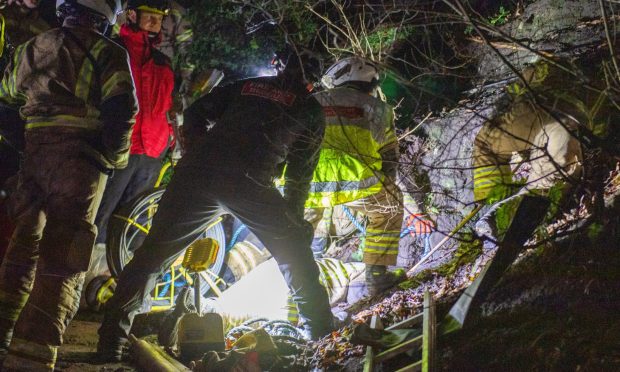 Rescuers attempting to recover the dog. Image: Kim Cessford/DC Thomson