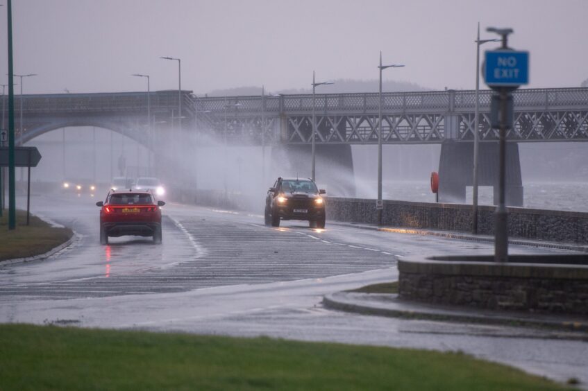 Waves hitting Riverside Drive on Friday morning.