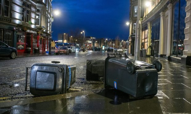 Bins blown over in Dundee city centre as Storm Eowyn picks up. Image: Kim Cessford/DC Thomson