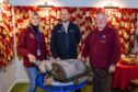 Neil White of Scottish Woodlands (centre) with Montrose Air Station Heritage Centre display coordinator Sian Brewis and chairman Stuart Archibald. Image: Jamie Dryden