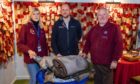 Neil White of Scottish Woodlands (centre) with Montrose Air Station Heritage Centre display coordinator Sian Brewis and chairman Stuart Archibald. Image: Jamie Dryden