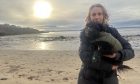 Families writer Cheryl Peebles on Kinghorn beach with schnoodle Ivy. Image: Cheryl Peebles