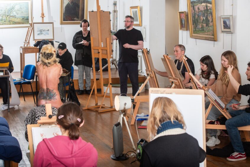 Artists in action at the life drawing class. 