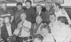 people watch a bottle smash at Sandy's Bar for Lochee pensioners in July 1986.