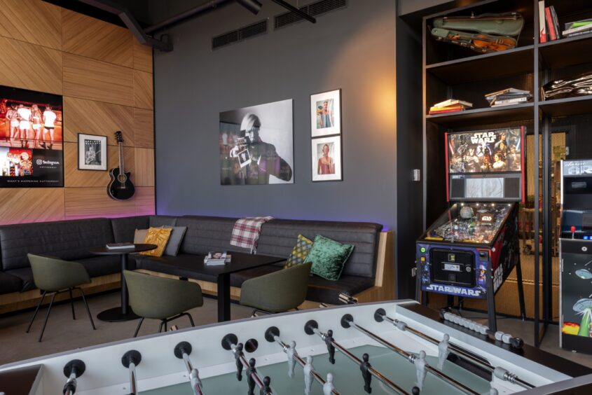 table football and arcade games in the games room in the bar at the Moxy Hotel.