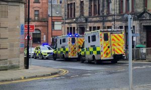 Police and paramedics at the scene after a man died in Dundee city centre