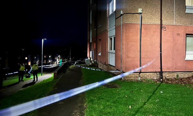 An area of Thurso Gardens in Menzieshill was taped off on Tuesday evening. Image: Ellidh Aitken/DC Thomson