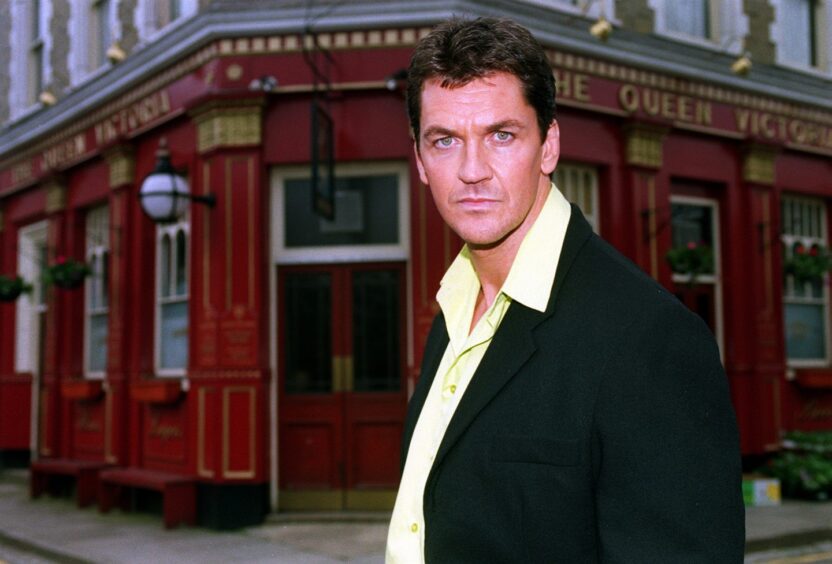 Actor Craig Fairbrass arrives in Albert Square in 1999 in a promotional shot for EastEnders that sees him standing outside The Queen Vi pub.