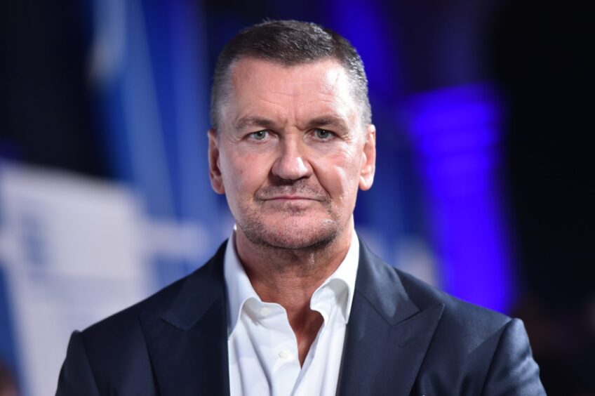 Actor Craig Fairbrass wearing a suit and looking straight at the camera 