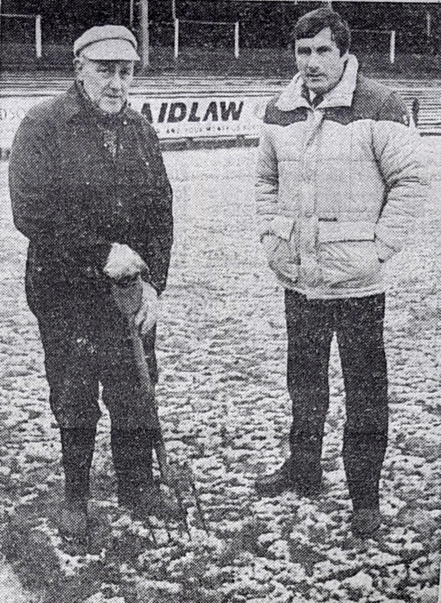 A groundsman holding a pitchfork and Raith Rovers manager Bobby Wilson at Stark's Park in January 1985