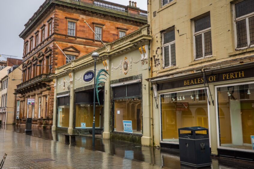 Empty McEwens of Perth store with Bliss Beds and Beales of Perth signs above doors