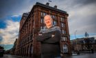 GP and rugby doc James Robson standing outside Meadowside in Dundee.