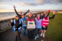 West Links parkrun event director Arthur Grant with the birthday cake and other key figures in the anniversary event. Image: Steve MacDougall/DC Thomson