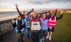 West Links parkrun event director Arthur Grant with the birthday cake and other key figures in the anniversary event. Image: Steve MacDougall/DC Thomson