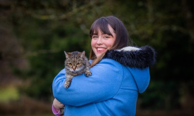 Millie, 28, and her cat Sibble, 22, have grown up together in Dunkeld. Image: Steve MacDougall/DC Thomson.