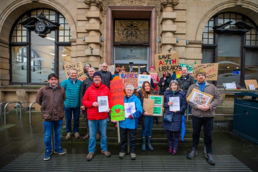 Grouop of people with placards standing on steps of Perth and Kinross Council HQ in Perth