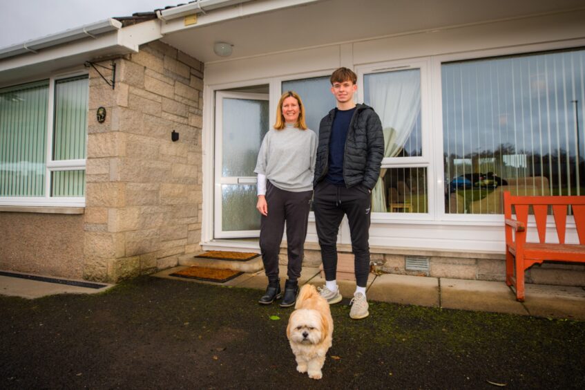 Fionna Williamson and son Ewan on doorstep of their Moulin home