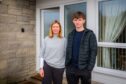 Fionna Williamson and son Ewan standing at door to their home in Moulin near Pitlochry