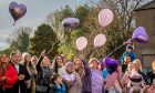 Lilac coloured balloons are released in Karen Dewar's memory at the memorial garden in Tayport. Image: Steve Brown/DC Thomson
