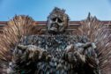 Knife Angel statue with pleading outstretched hands outside Perth Museum