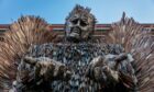 Knife Angel statue with pleading outstretched hands outside Perth Museum