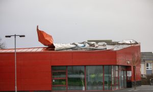 Metal sheets hanging off the roof of the Dunfermline building during Storm Eowyn