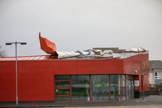 Metal sheets hanging off the roof of the Dunfermline building during Storm Eowyn