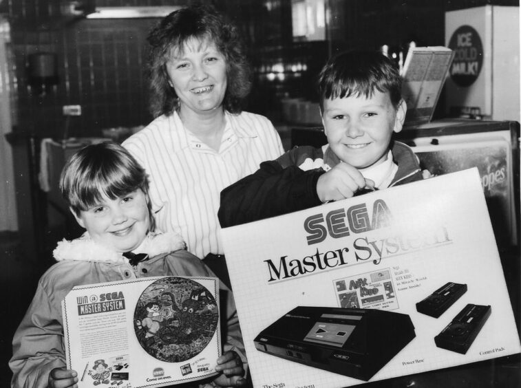 Greg Nicol and sister Lynne with manager Jessie Murray and their Sega