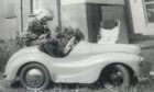 Dave Brown with his Austin J40 pedal car as a youngster in Letham.