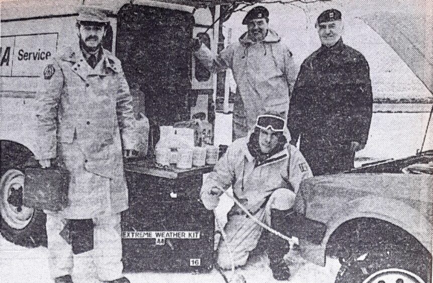 The AA crew beside their vehicle with the Nasa all-weather jackets.