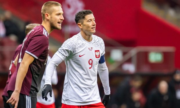 Daniels Balodis marking Robert Lewandowski when Latvia played Poland.