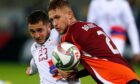 Daniels Balodis playing for Latvia against Armenia.