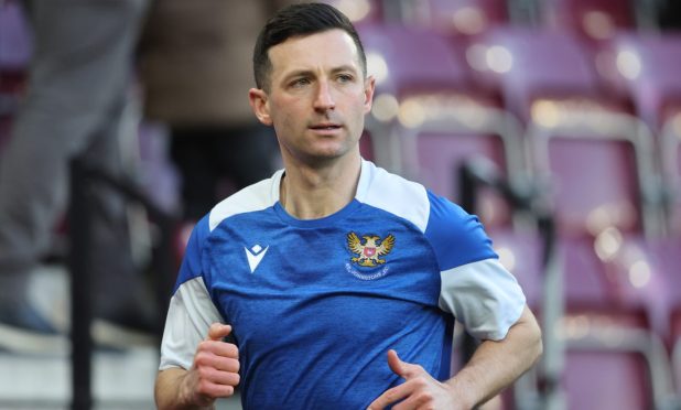 Jason Holt warming up before a game against Hearts.